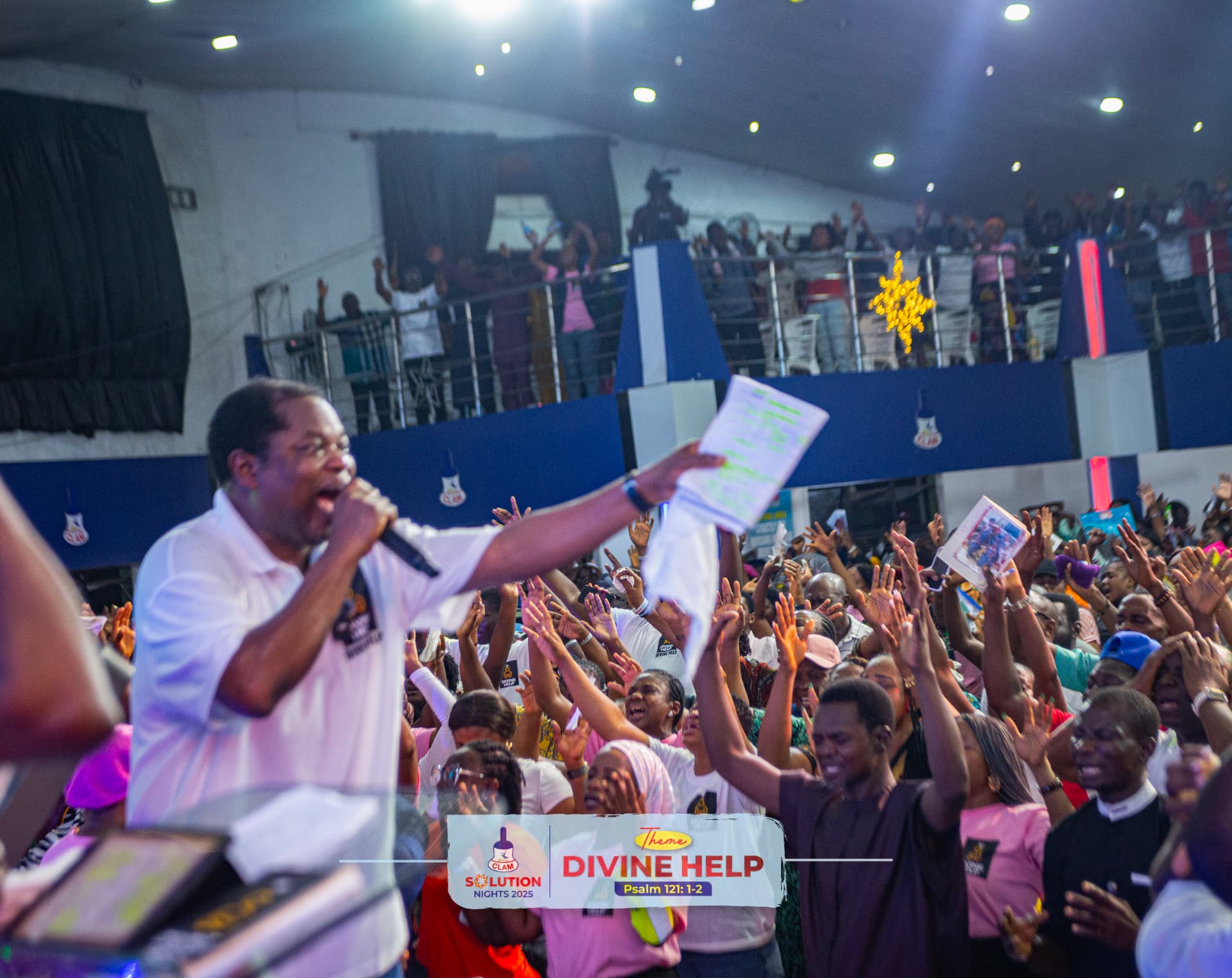 Pastor Wole Oladiyun leading the congregation in prayer